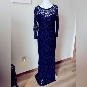 Full length lace overlay formal gown In Midnight Blue.